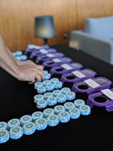 Poker chips lined up near the lids of potential Xamarin.Forms features