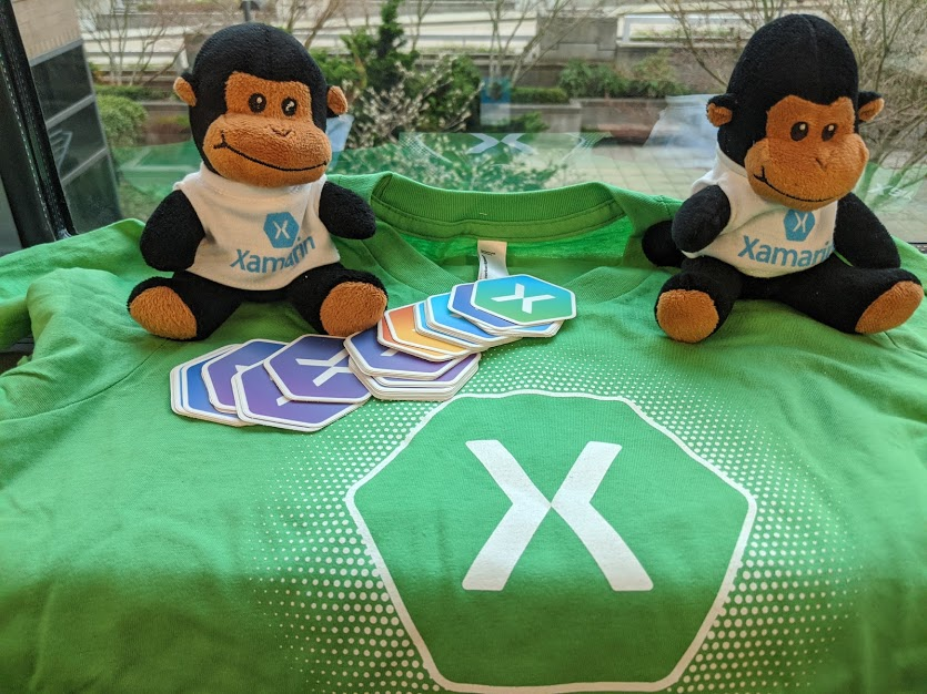 Xamarin swag including stickers, monkeys, and shirts