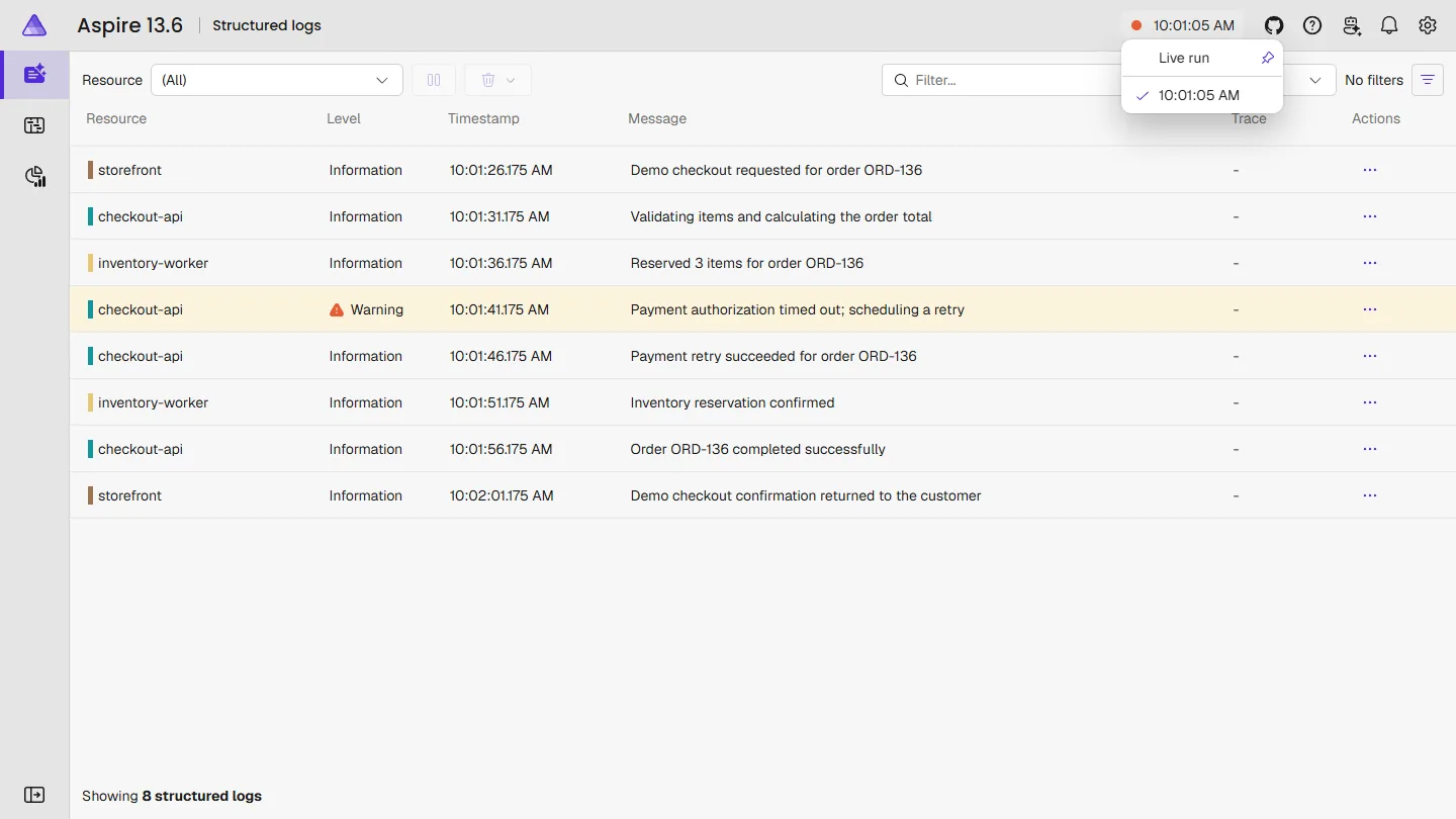 The Aspire 13.6 dashboard showing structured logs from an earlier run with the run selector open
