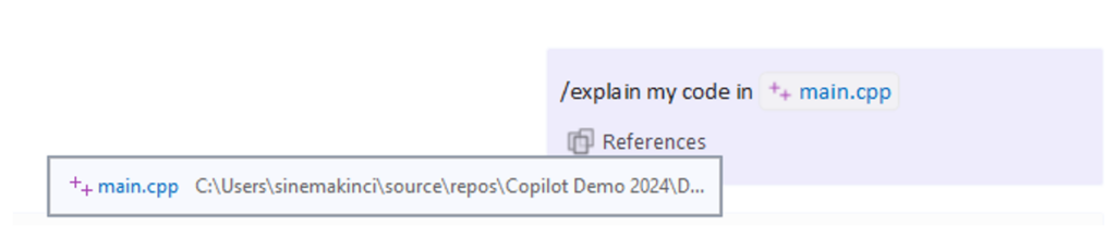 The References flyout in Copilot Chat showing a file reference to main.cpp when a file context is specified.