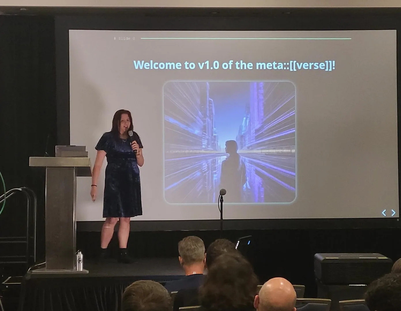 An image of a person standing in front of a projection screen showing a slide for a talk on C++ static reflection