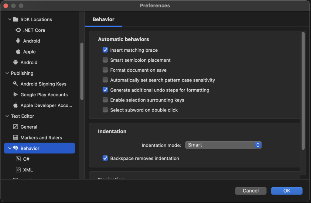 The Visual Studio Preferences menu open to Text Editor Behaviors settings, such as "insert matching braces"