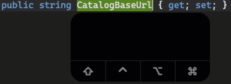 一个文本编辑器，显示代码“publicstaticCatalogBaseURL”，并通过键盘移动单词Catalog Base和URL。