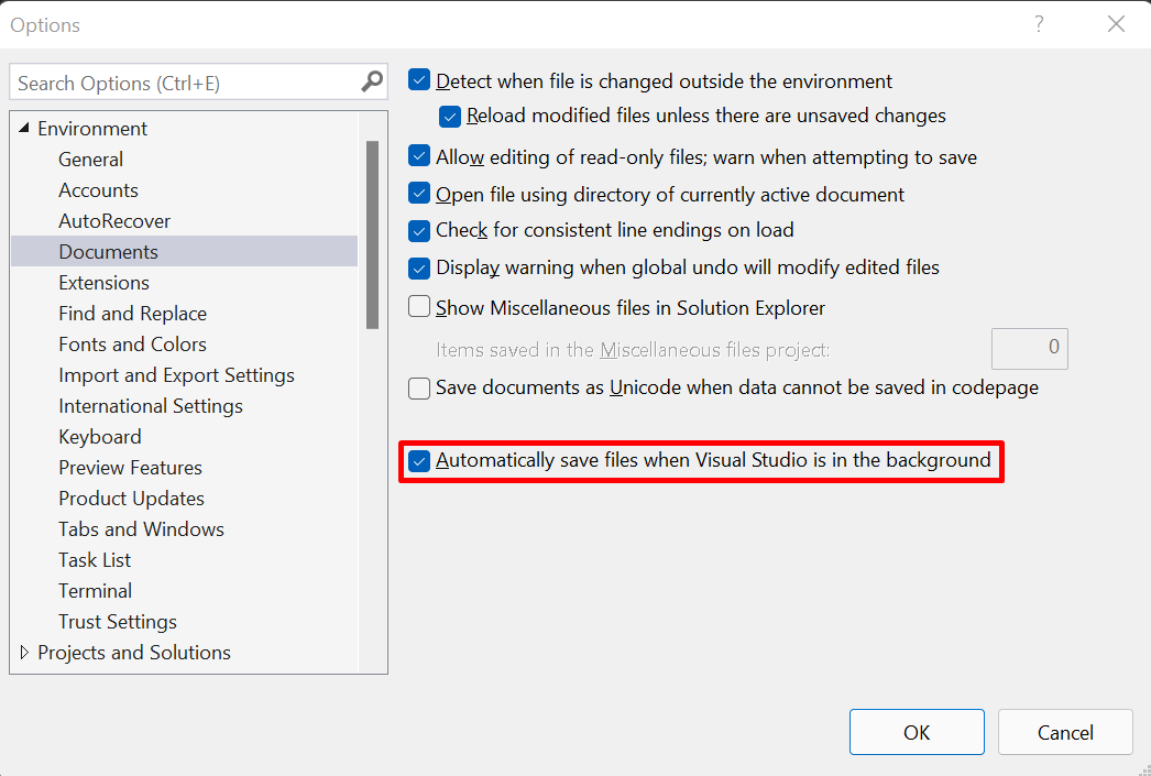 Screenshot of the Environment > Documents Options page showing the "Automatically save files when Visual Studio is in the background" feature