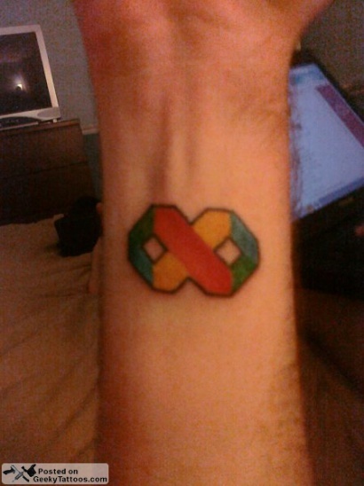 A developer’s Visual Studio logo tattoo, shared on GeekyTattoos.com—now that’s superfan love!